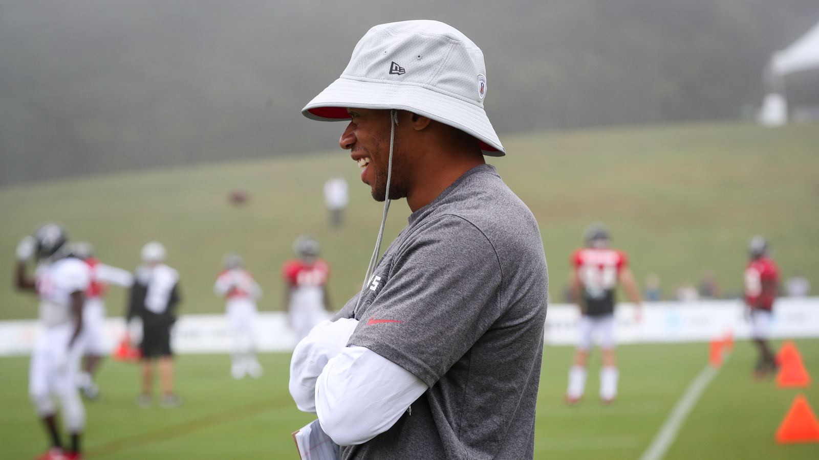 Roosevelt Boone observing practice from the sideline at Atlanta Falcons training camp