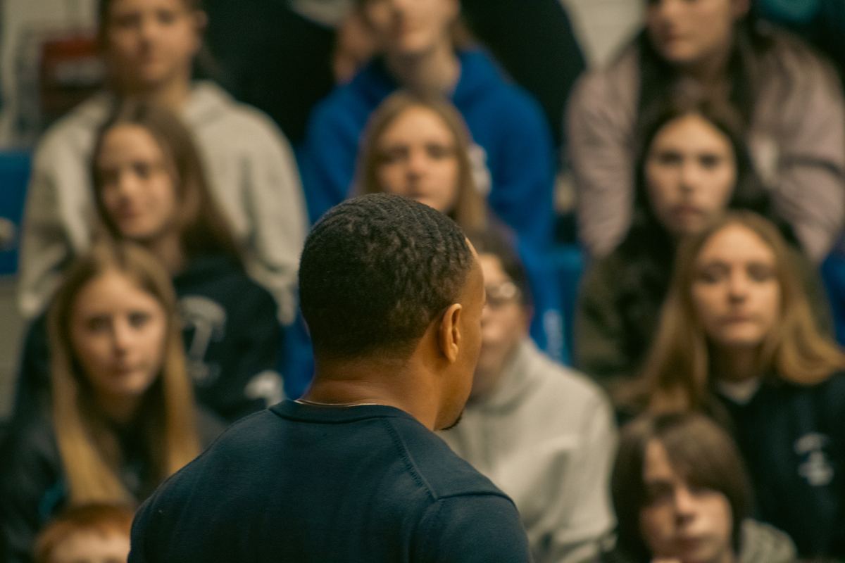 SMSB Inc. speaker engaging students in a school gymnasium